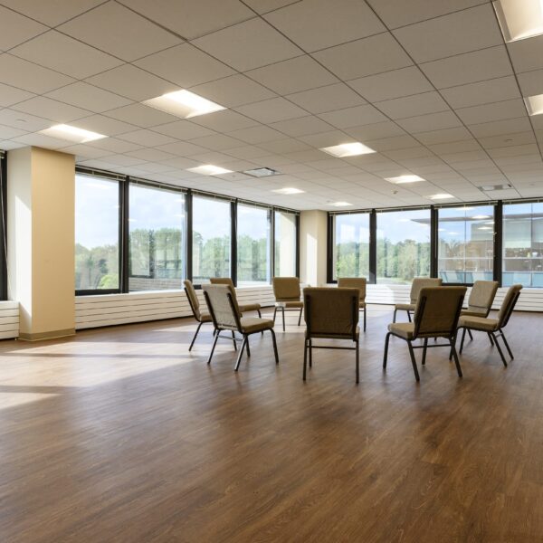 spacious room for having addiction therapy group meetings - chairs in circle